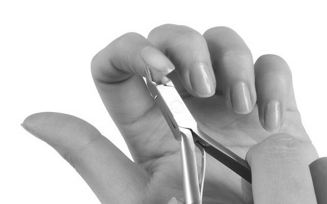 When having a manicure, why is the cuticle cut off? image 0